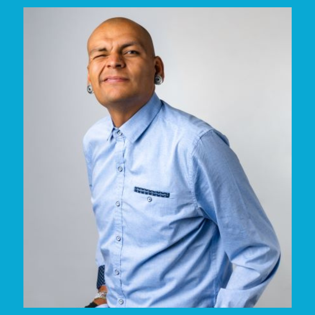 headshot of Alejandro Jimenez winking at the camera