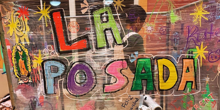 letters "La posada" painted on a plastic