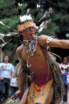 picture of a male pomo dancer looking away from the camera