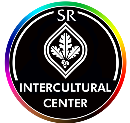 logo of SR Intercultural Center: a black circle with a rainbow around and a white oak leaf in the middle 