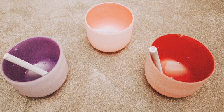 Three glass bowls used in sound bath medication